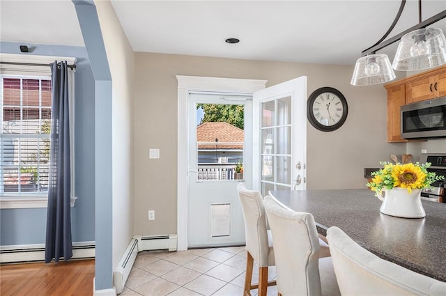 interior space with a wealth of natural light and light tile patterned floors