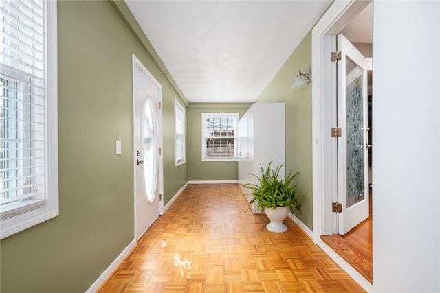 corridor featuring light parquet floors