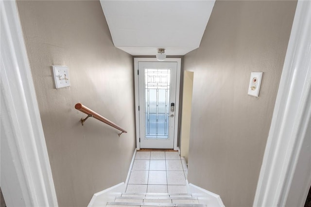 doorway to outside featuring light tile patterned floors