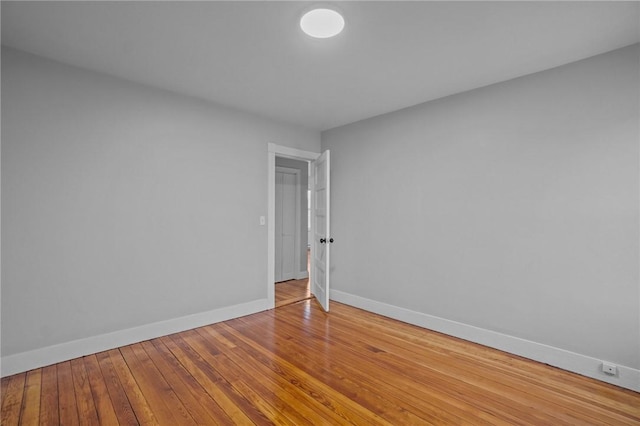 unfurnished room featuring hardwood / wood-style floors