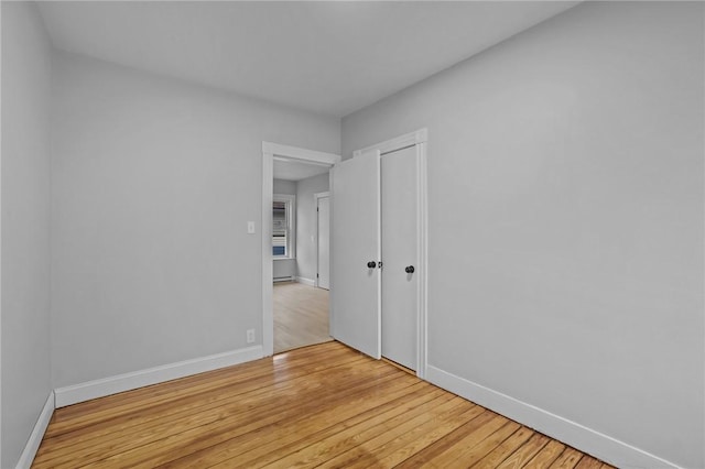 spare room with light wood-type flooring