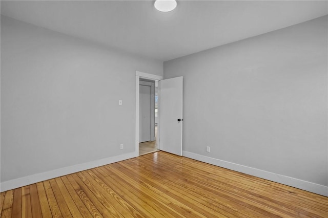 spare room with hardwood / wood-style flooring