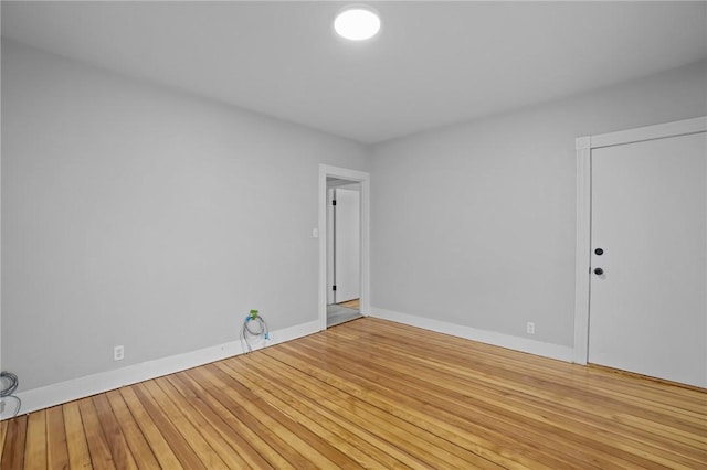 unfurnished room featuring hardwood / wood-style floors