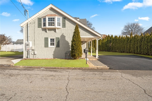 view of side of home featuring a yard