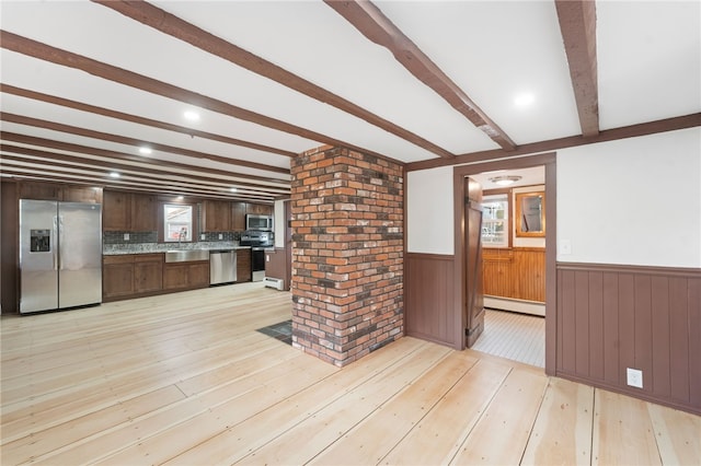 kitchen with a baseboard heating unit, beam ceiling, dark brown cabinets, stainless steel appliances, and light wood-type flooring