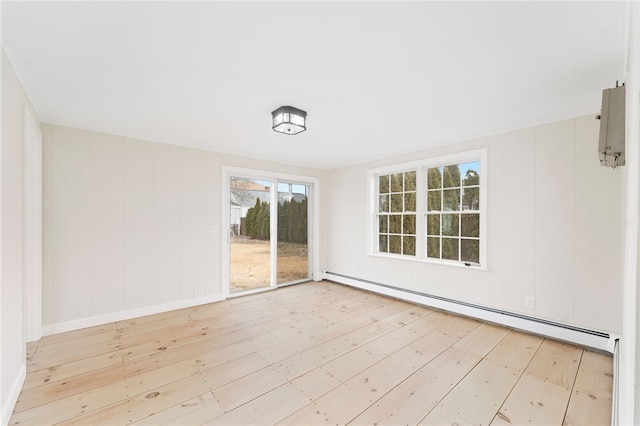 interior space with a baseboard radiator and light wood-type flooring