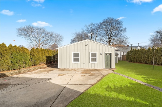 view of outbuilding with a yard