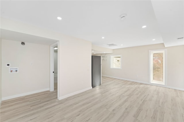 spare room featuring light hardwood / wood-style flooring