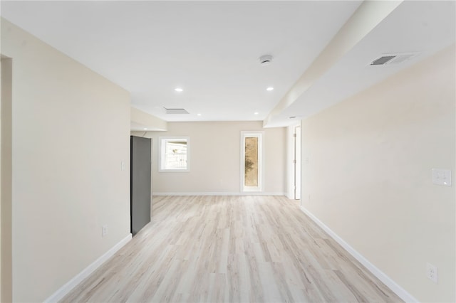 unfurnished room with light hardwood / wood-style floors