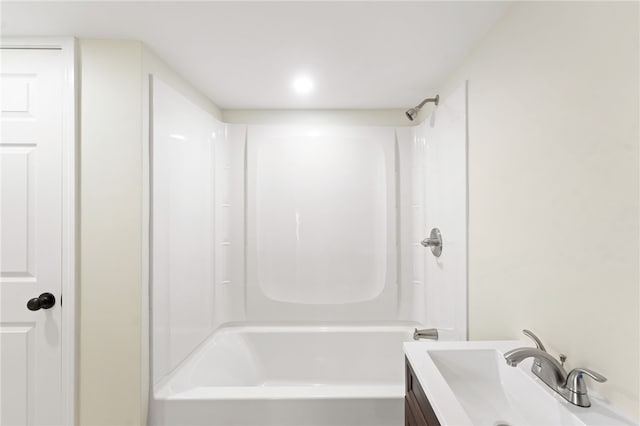 bathroom with vanity and washtub / shower combination