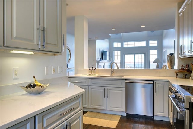 kitchen featuring appliances with stainless steel finishes, sink, and gray cabinetry