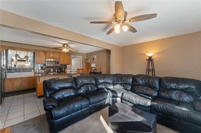 tiled living room with ceiling fan