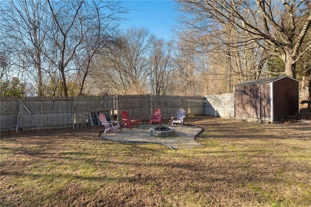 view of yard featuring a storage unit and a fire pit