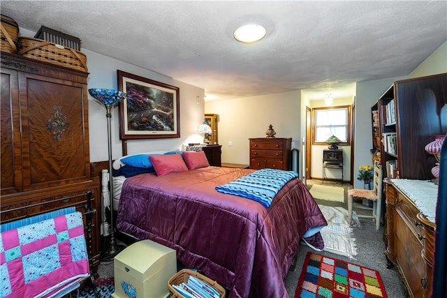 carpeted bedroom with a textured ceiling