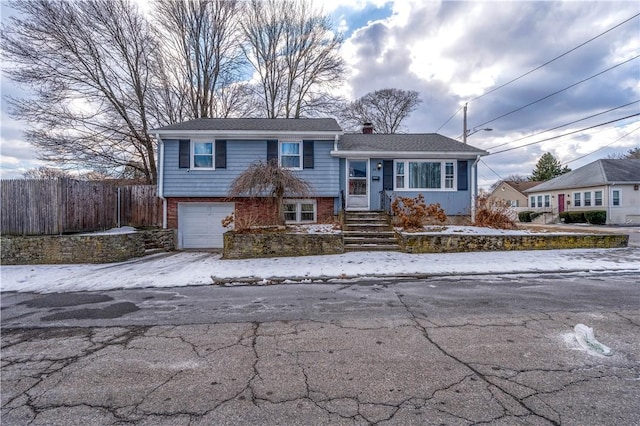 split level home with a garage