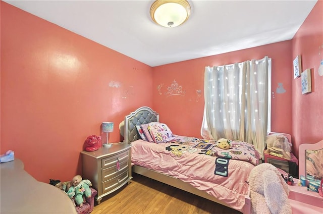 bedroom with light hardwood / wood-style floors