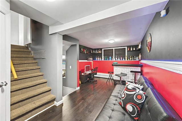 game room with indoor bar and wood-type flooring