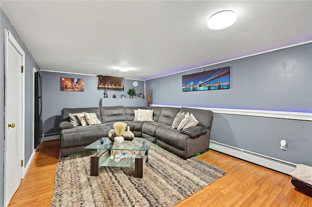 living room with a baseboard radiator and wood-type flooring