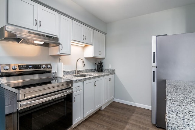 kitchen with stainless steel appliances, light stone countertops, sink, and white cabinets