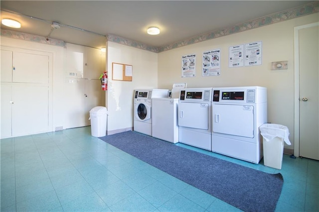 clothes washing area featuring washer and dryer