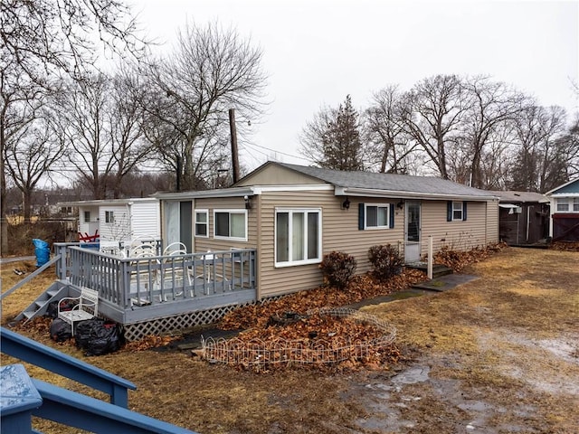 rear view of house with a deck