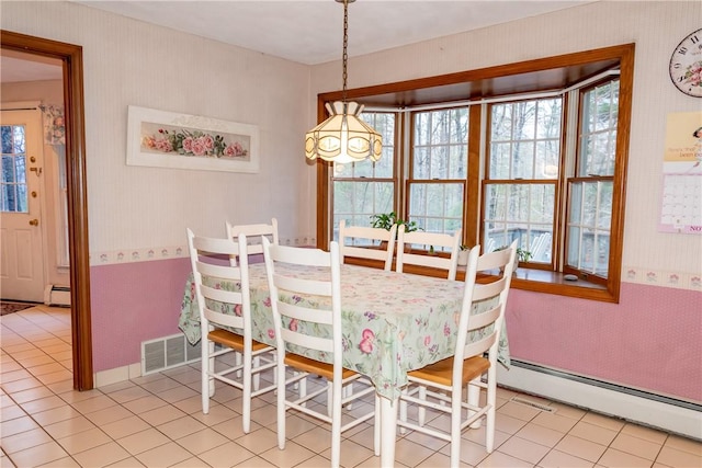 tiled dining area with baseboard heating