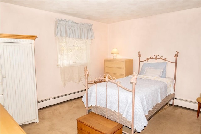 carpeted bedroom featuring a baseboard heating unit