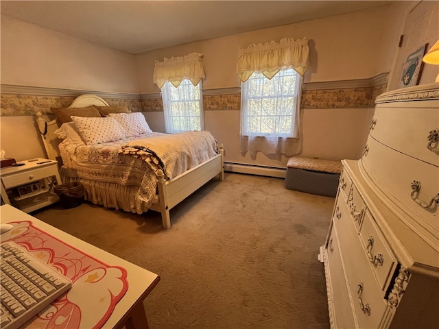 carpeted bedroom featuring a baseboard heating unit