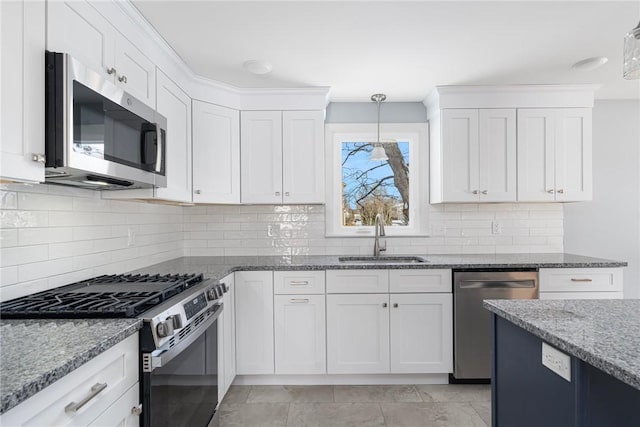 kitchen featuring white cabinetry, sink, and appliances with stainless steel finishes