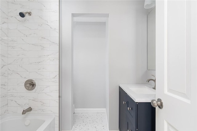 bathroom featuring vanity and tiled shower / bath combo