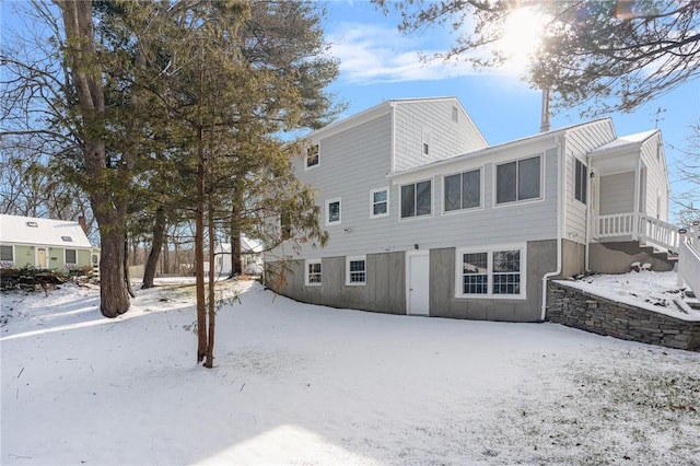 view of snow covered house