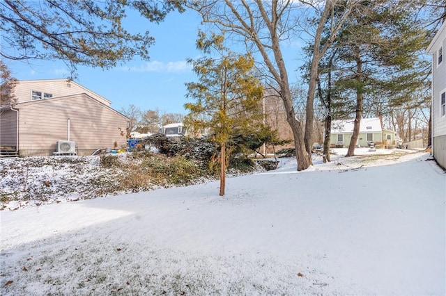 view of yard layered in snow