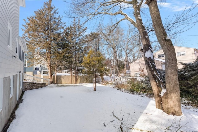 view of yard layered in snow