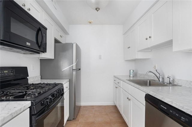 kitchen featuring white cabinetry, light stone countertops, sink, and black appliances