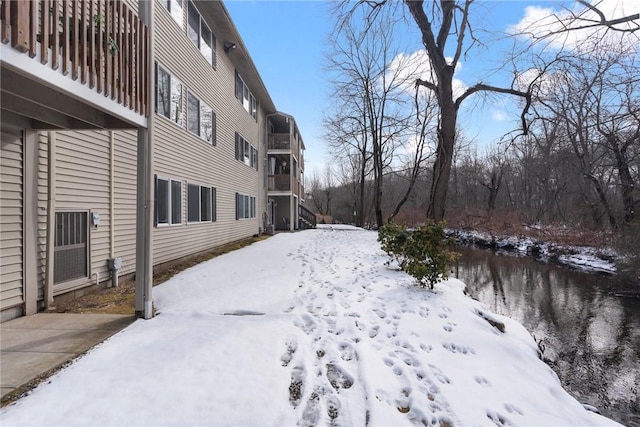 view of yard layered in snow