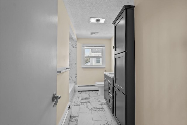 full bathroom with baseboard heating, vanity, toilet, and a textured ceiling