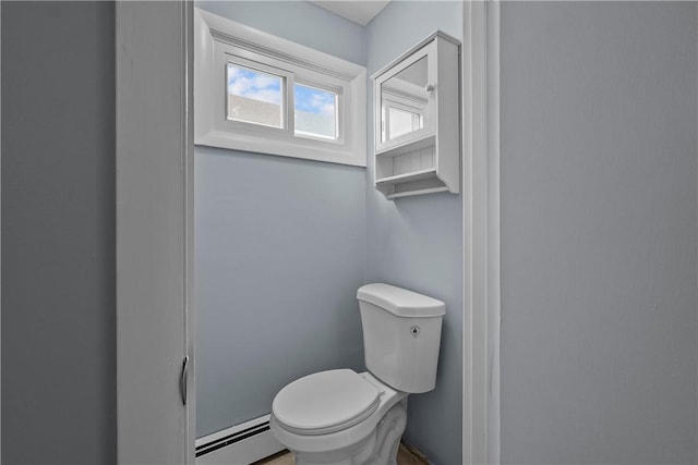 bathroom featuring a baseboard radiator and toilet