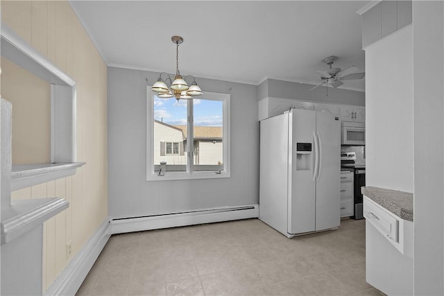 kitchen with crown molding, hanging light fixtures, baseboard heating, white appliances, and ceiling fan with notable chandelier