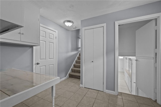 interior space with light tile patterned floors