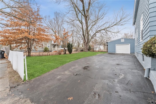 view of yard with a garage and an outdoor structure