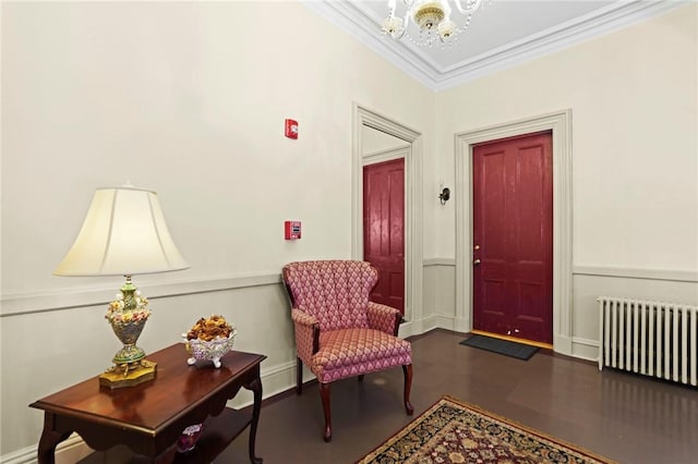 45 Ayrault St Unit 11, Newport, RI 02840 - entrance foyer with hardwood / wood-style flooring, crown molding, radiator heating unit, and a notable chandelier