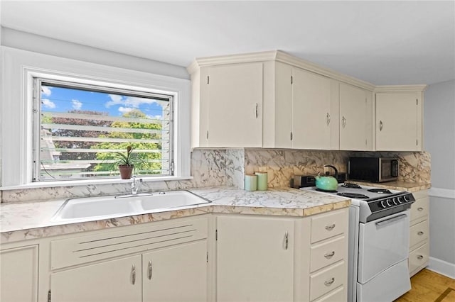 45 Ayrault St Unit 11, Newport, RI 02840 - kitchen with tasteful backsplash, sink, and electric range