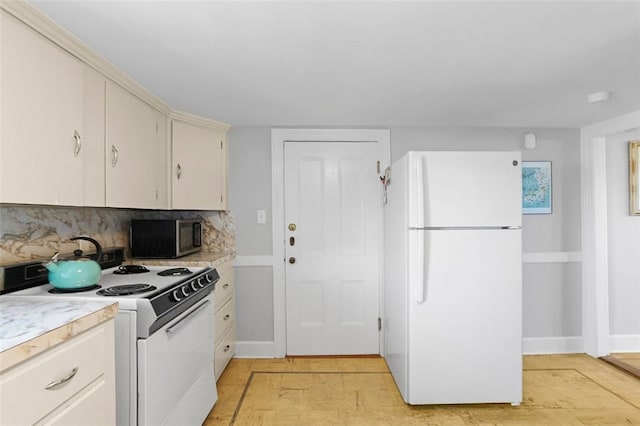 45 Ayrault St Unit 11, Newport, RI 02840 - kitchen featuring white appliances and decorative backsplash