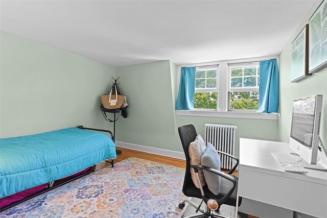 45 Ayrault St Unit 11, Newport, RI 02840 - bedroom featuring radiator heating unit and light hardwood / wood-style floors