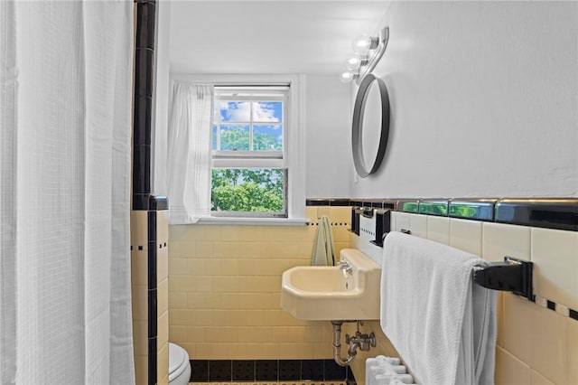 45 Ayrault St Unit 11, Newport, RI 02840 - bathroom featuring a shower with curtain, toilet, sink, and tile walls