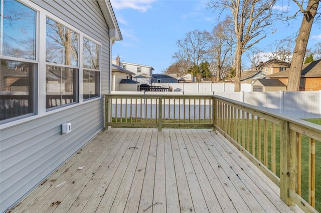 wooden terrace with a yard