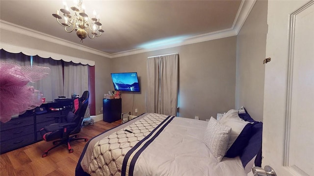 bedroom featuring crown molding, a notable chandelier, and hardwood / wood-style flooring