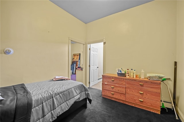 bedroom with a baseboard radiator and carpet floors