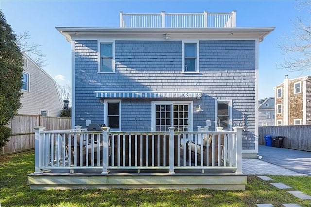 rear view of property with a deck