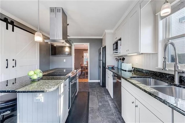 kitchen featuring appliances with stainless steel finishes, decorative light fixtures, sink, white cabinets, and island exhaust hood